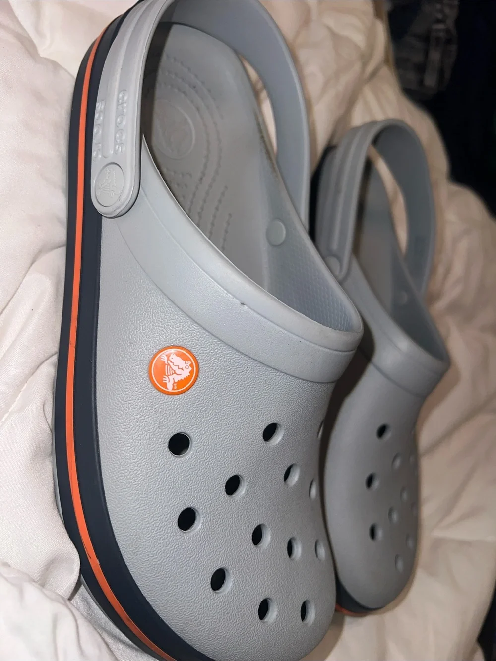 Crocs Crocband Unisex-Clogs in the light grey/navy/orange colorway. (11016-01U.)
